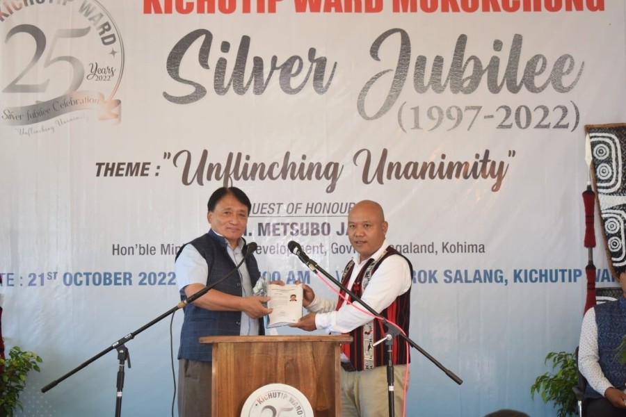Minister Metsubo releases the jubilee souvenir of Kichutip Ward Silver Jubilee celebration at Arok Salang, Kichutip Ward, Mokokchung on October 21. (Morung Photo)